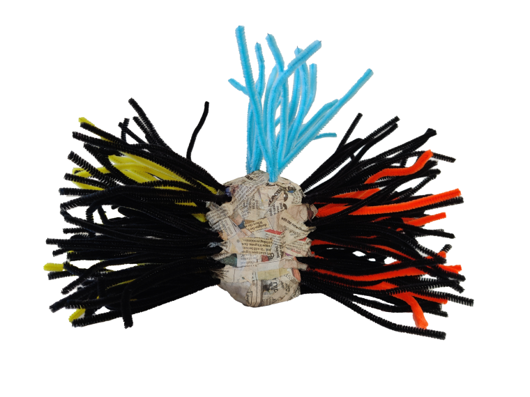 A 3D sculpture made of chicken wire, coloured pipe cleaners sticking out of the chicken wire ball, with papier mache covering the ball