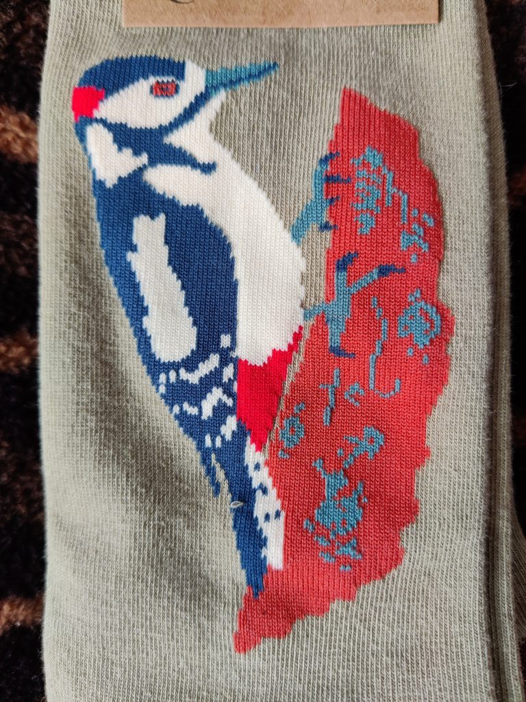 photo of sock with Woodpecker image woven into ankle