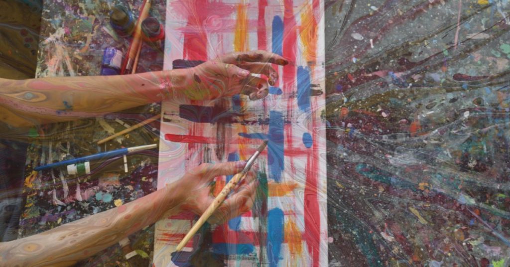 Abstract art of inner parts emerging through creative expression, symbolising acceptance in therapy